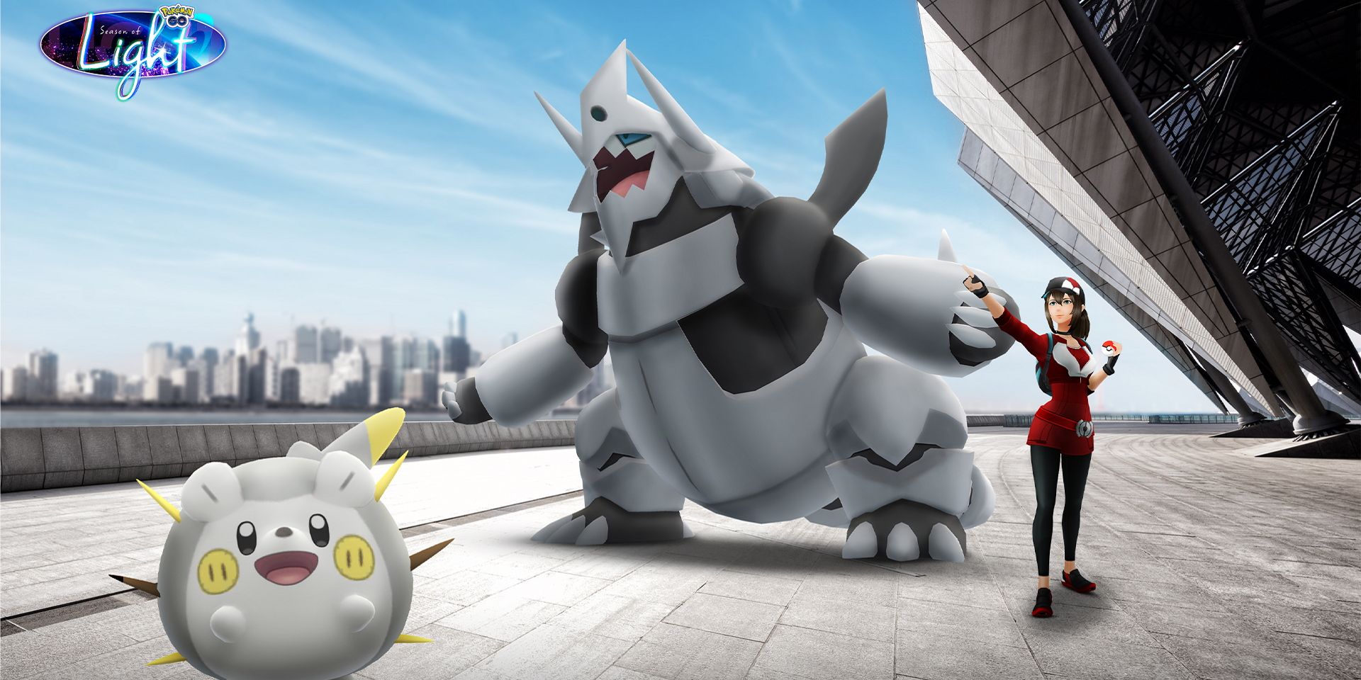 Image de Mega Aggron avec Togedemaru et un dresseur de Pokémon de chaque côté