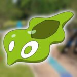 A small green Zygarde cell is visible, and posed in front of a blurred picture of Pokemon Go routes