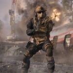Le bug le plus fou de Warzone est de retour dans Modern Warfare 3 alors que les développeurs de Call of Duty cherchent à le résoudre A soldier firing an LMG as explosions go off behind them