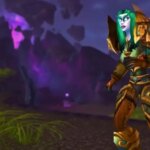 A woman with green hair and armor running in WoW