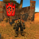 Meilleures constructions de talents et runes pour les chasseurs dans WoW SoD Image of an Orcish hunter standing beside a Horde banner.