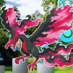 Galarian Moltres and some Squirtle in front of a PokeStop in Pokemon Go