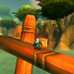 Comment obtenir la double spécialisation dans WoW Classic Saison de la Découverte A gnome standing on the docks waiting for a boat at Booty Bay in WoW Classic