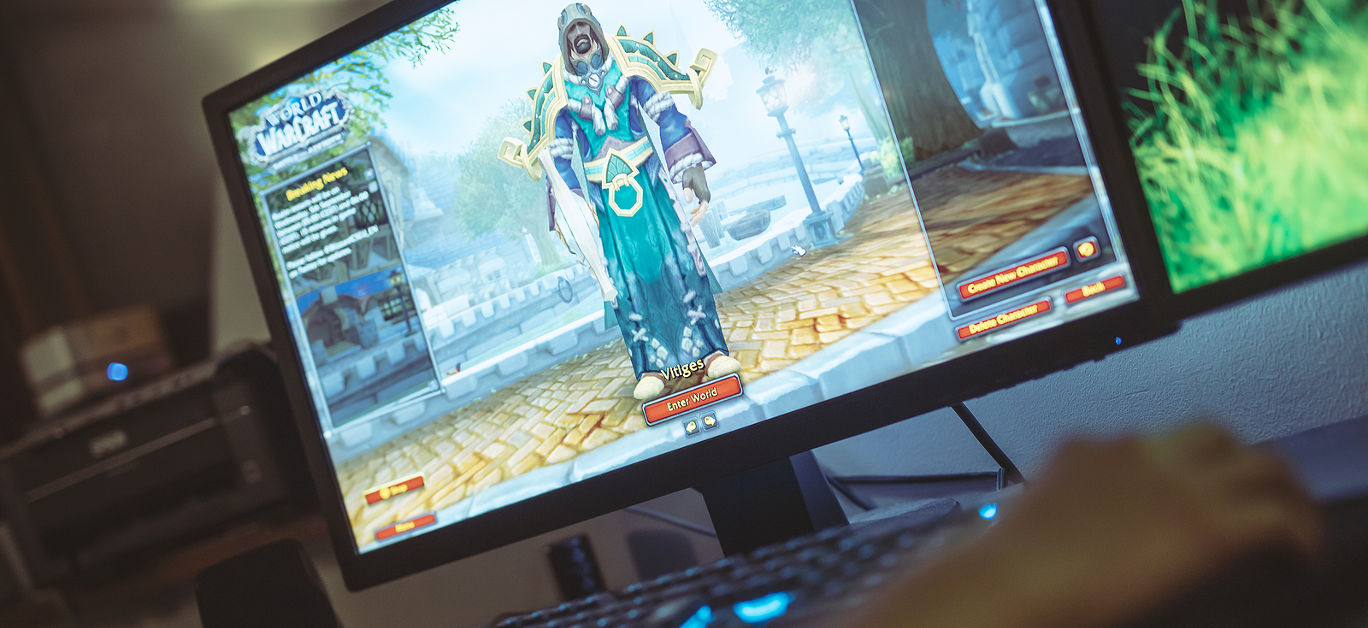 Woman playing World of Warcraft: Battle of Azeroth game