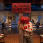 An Operator hugging a pole with a sign that reads "I need a friend" in the Valentine