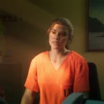 GTA 6 pourrait générer 92 milliards de dollars pour l'industrie du jeu GTA 6 screenshot of Lucia sitting in the prison office wearing orange prison clothes looking on.