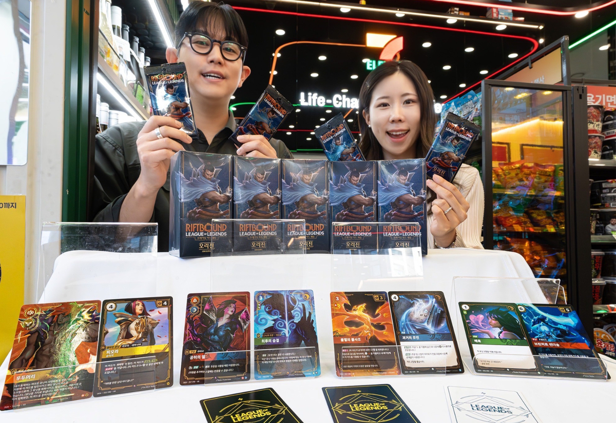 7-Eleven staff present Riftbound: Origins, the first official physical trading cards for the popular game "League of Legends." Courtesy of 7-Eleven - Seoul Economic Daily Finance News from South Korea