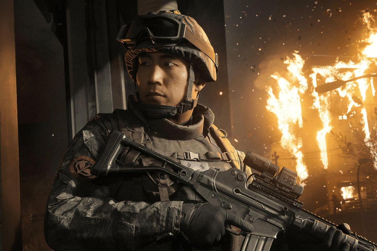A scene from Call of Duty: Modern Warfare 4 shows a soldier amid burning buildings during a fictional North Korean invasion of South Korea. (Photo via Activision)
